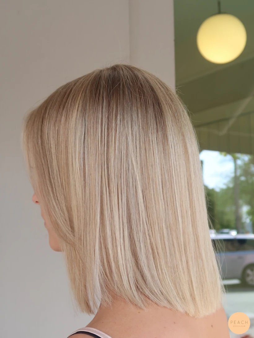 Blond lob slingor blont hår