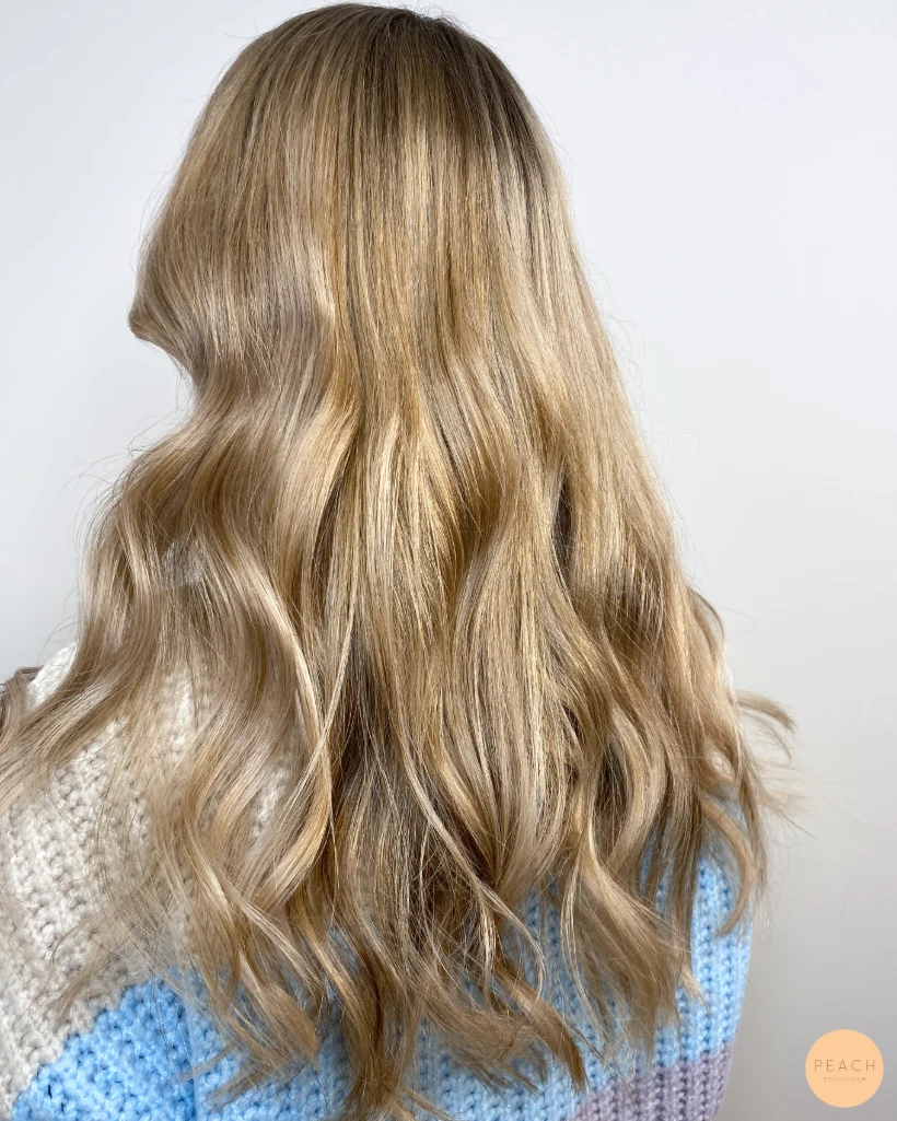 Beige blonde balayage on brown hair