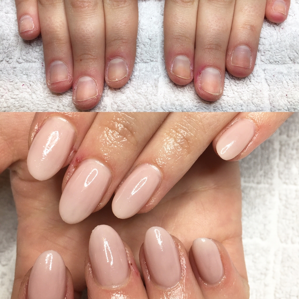 Nagelförlängning på nagelbitare med röda toner