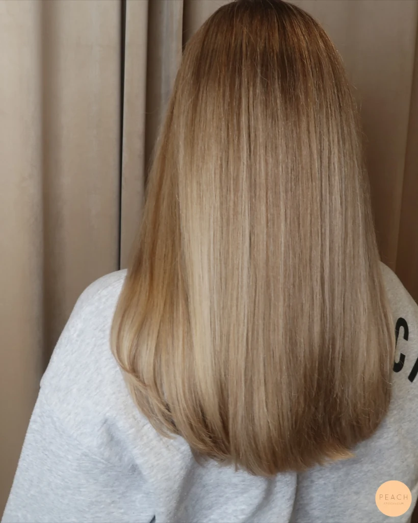 Mjuka beige slingor med fade mot botten