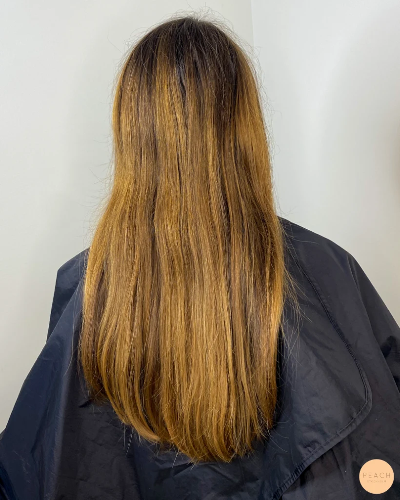 Beige blonde balayage on brown hair
