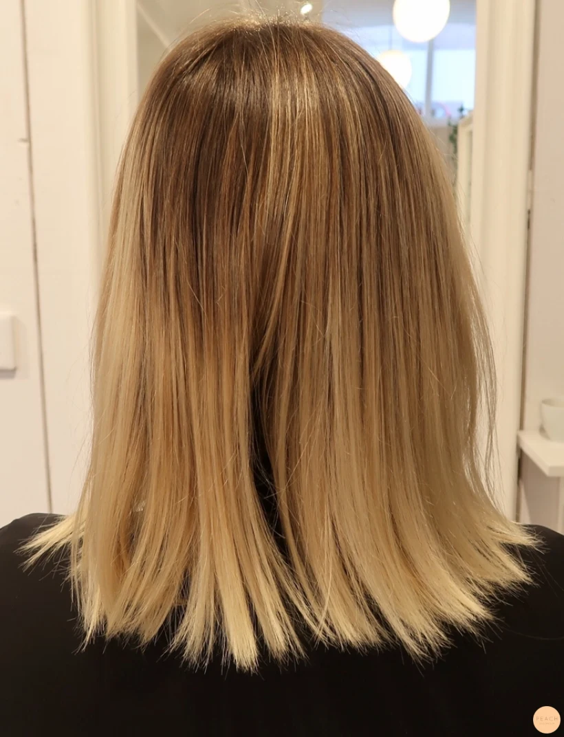 Balayage blonda slingor skiftningar