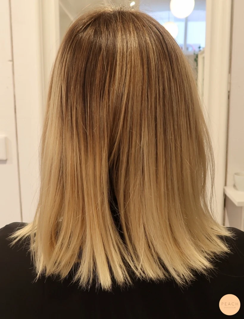 Balayage blonda slingor skiftningar