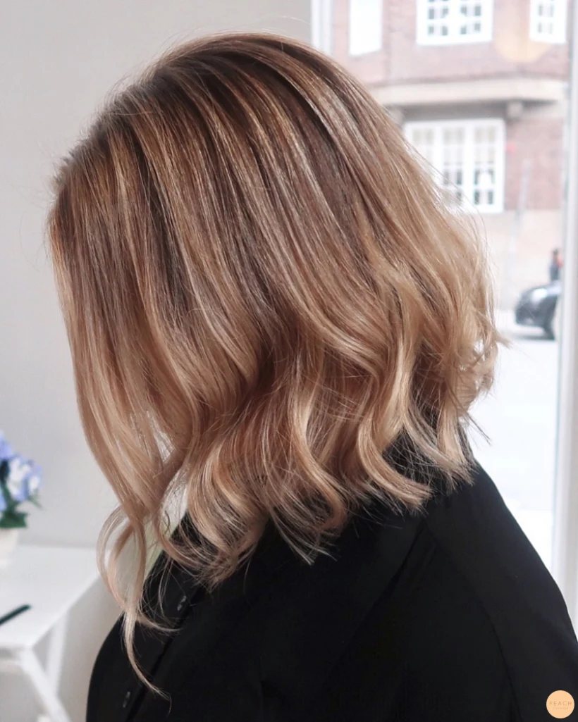Balayage blonda slingor skiftningar
