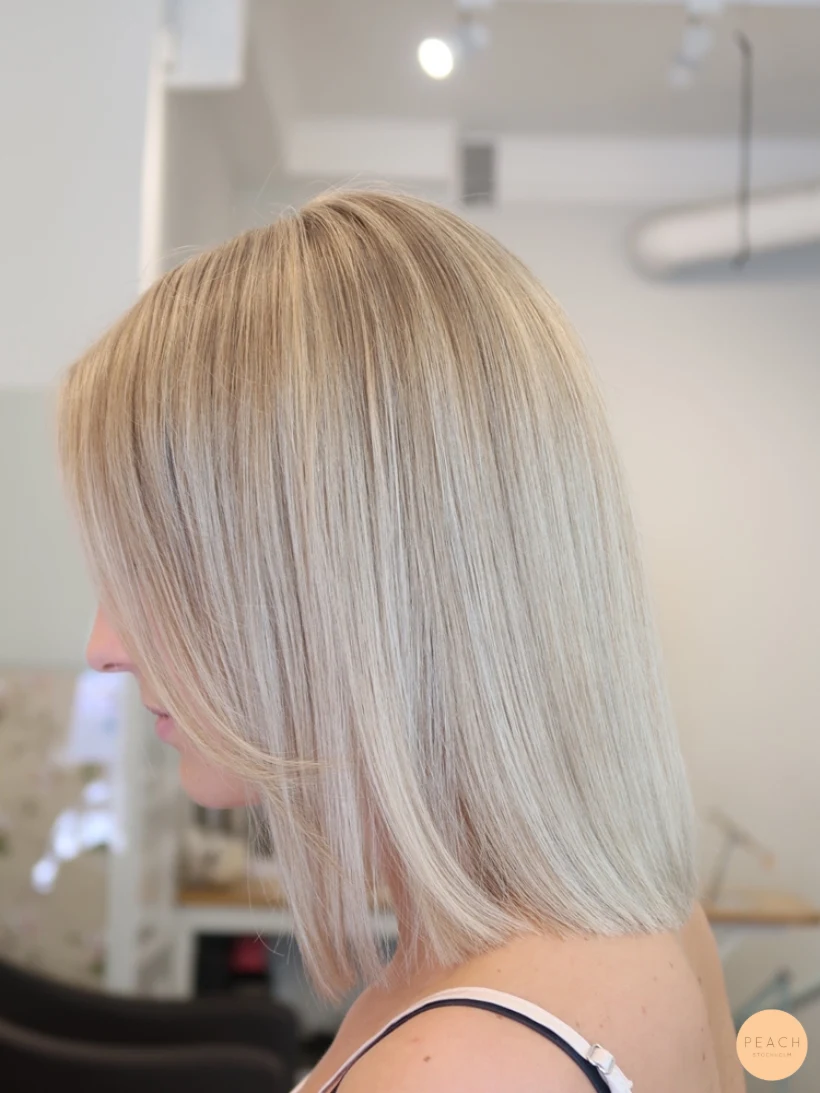 Blond lob slingor blont hår