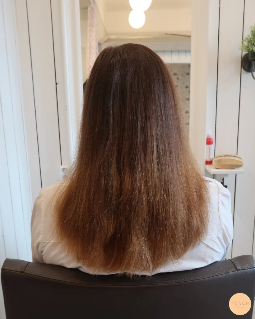 Balayage i brunt hår, varm hårfärg med toner av kanel och honung