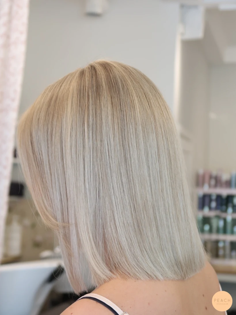 Blond lob slingor blont hår